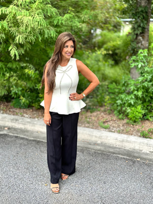 white top with black pants