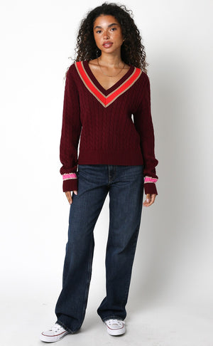burgundy sweater with pink trim
